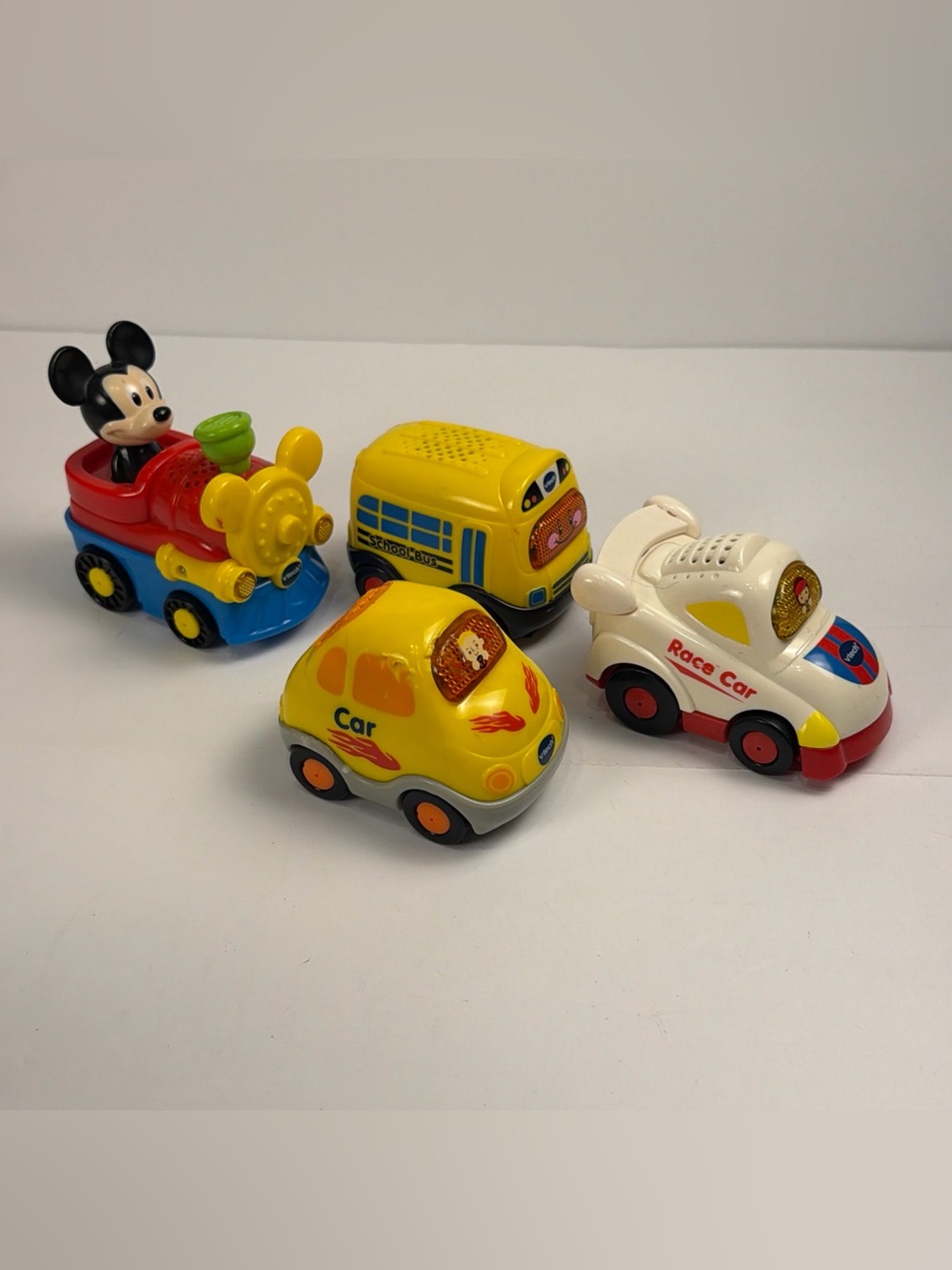 Vtech go go smart wheels lot of 4 Mickey Train, Race Car, Bus, Yellow Car